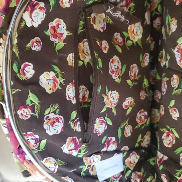 Vera bradley purse with 3 compartments and several pockets inside. - Picture 3 of 5
